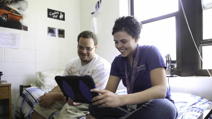Students using a mobile device.